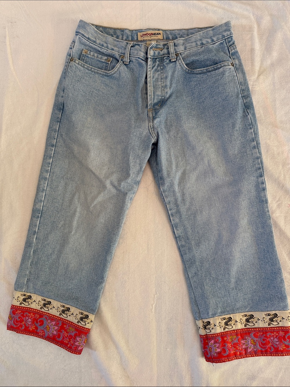 LONDONJEAN Capri Light Blue Jeans with Red Embroidered Cuffs. Button fly